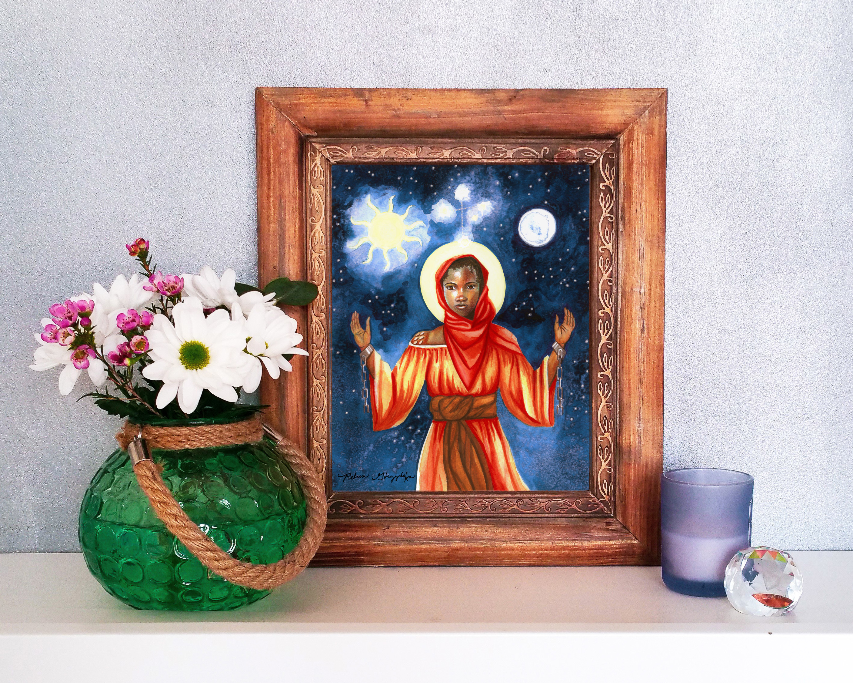 brown frame african girl orange dress, red scarf, sun moon star cross