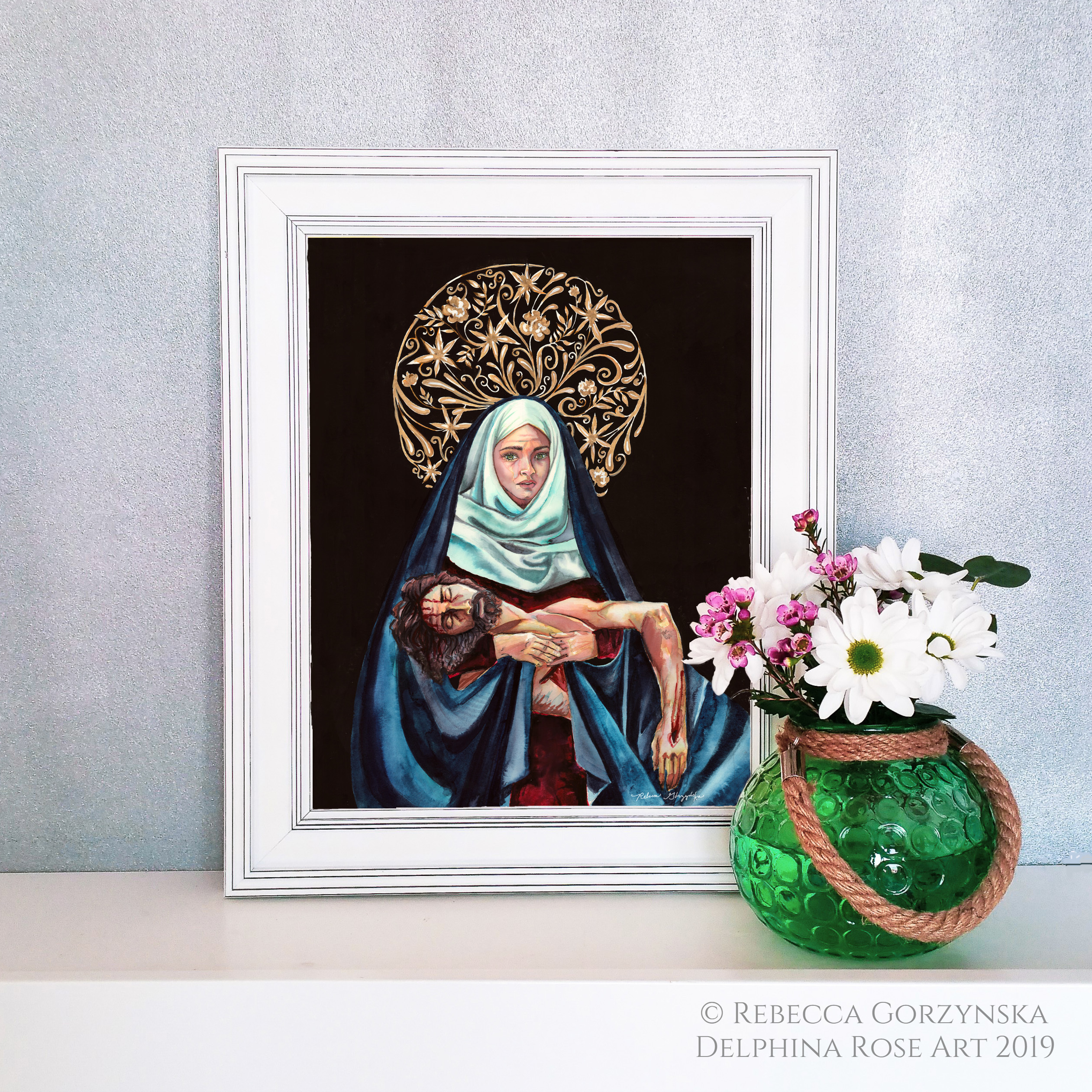 pieta - Mary in white scarf and blue mantle holding dead Christ. Black background and intricate gold floral halo