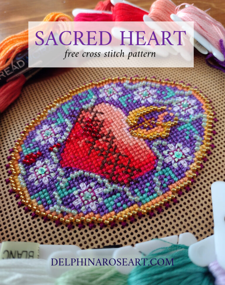 Close up of a Sacred Heart beaded cross stitch. It shows a red heart with flames and a cross on the top, a crown of thorns, on a purple background with white passionflowers.